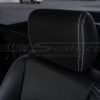 Leather headrest with white stitching