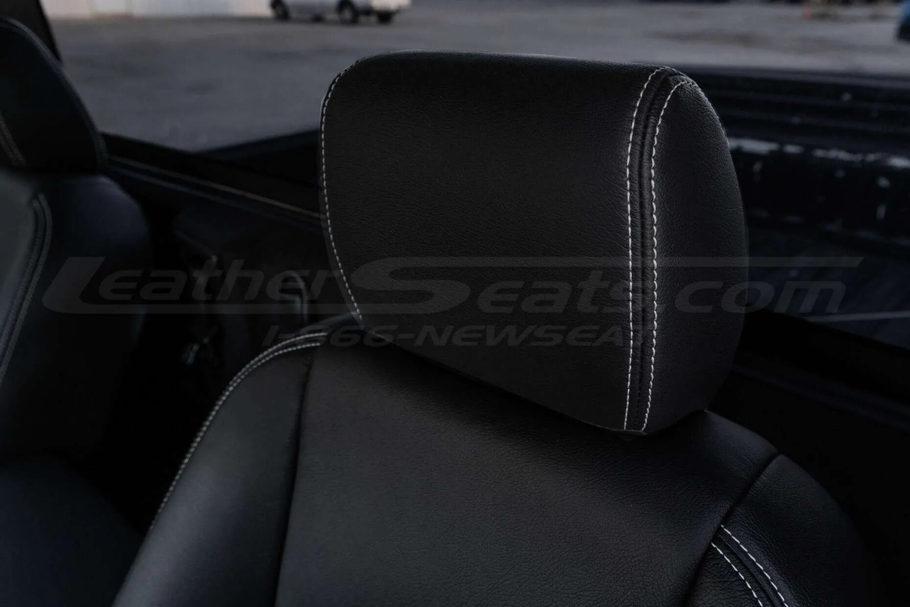 Leather headrest with white stitching