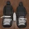 Back view of front seats and console lid cover