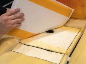 Determine where the TED will attach to the adhesive side of the distribution pad and trace the hole with the provided template.