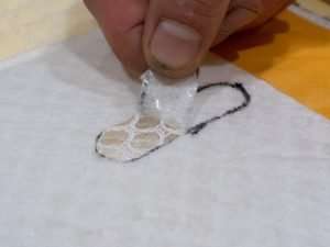 Removing the outer layer of the distribution pad