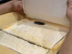 Placing the Carbon Fiber heating pad onto the seat cushion