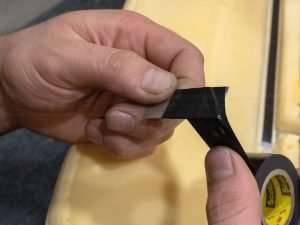 Wrapping razor blade in electric tape for safety