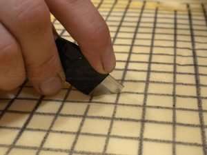 Begin cutting traced grid