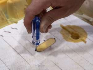 Start removing foam from the traced hole