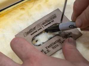 Continue removing foam from traced hole