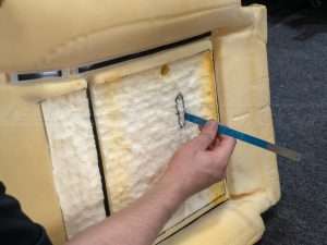 Removing foam from the top and bottom of the seat cushion