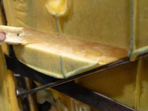 Removing strip of foam from back of seat