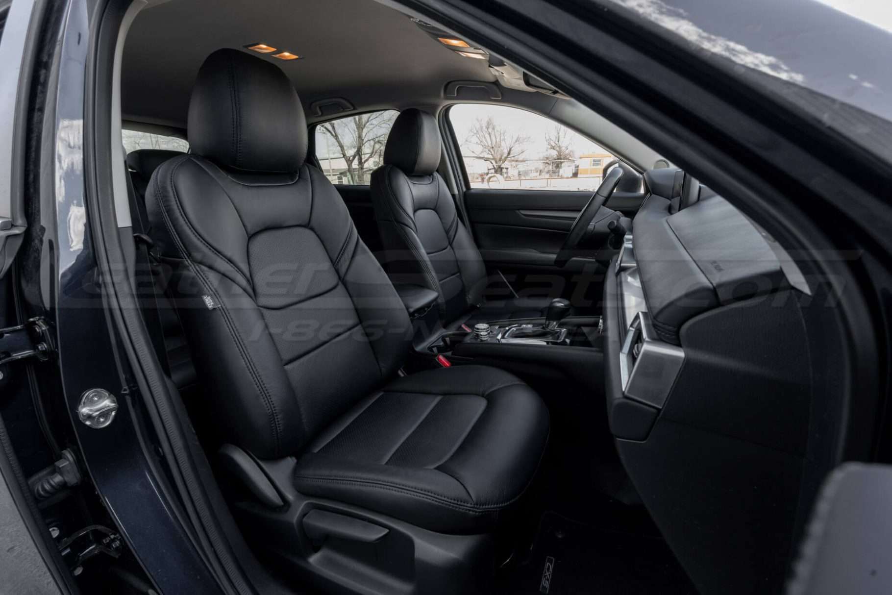 Mazda CX5 Touring with leather seats - black - Front seat from passenger side