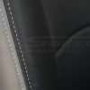 Contrasting dove-grey stitching on backrest