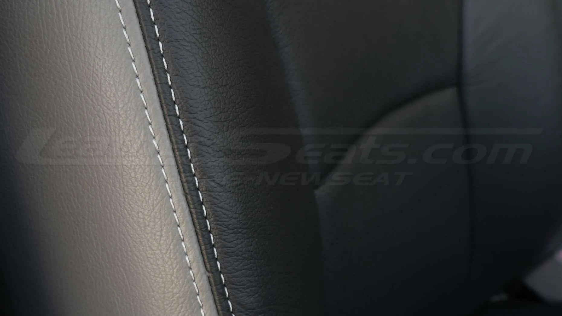 Contrasting dove-grey stitching on backrest