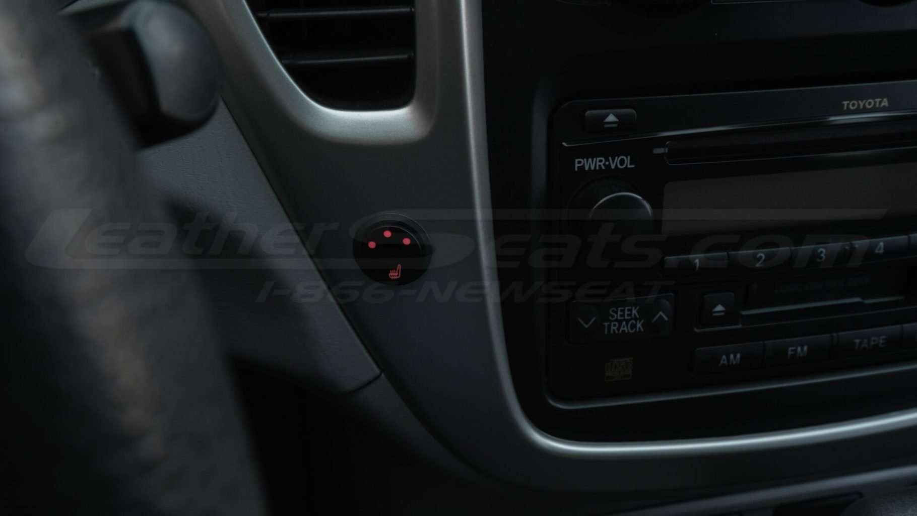 Round switch seat heater on driver's sde