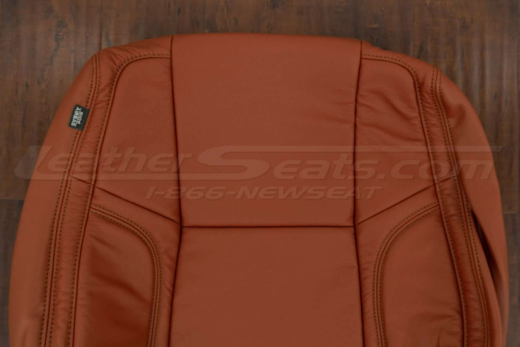 Upper section of front backrest upholstery