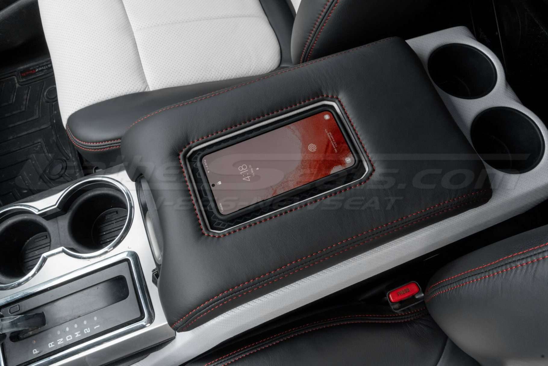 Wireless Charging console with phone as example