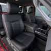 Passenger side view of front leather seats in Black