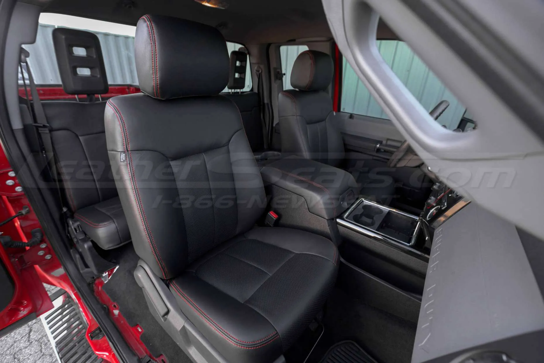 Passenger side view of front leather seats in Black
