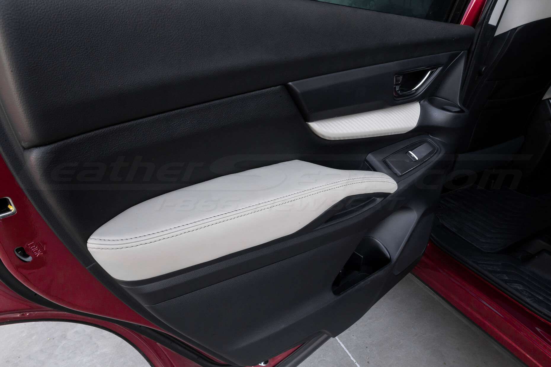 Medium range view of leather door armrests & insert