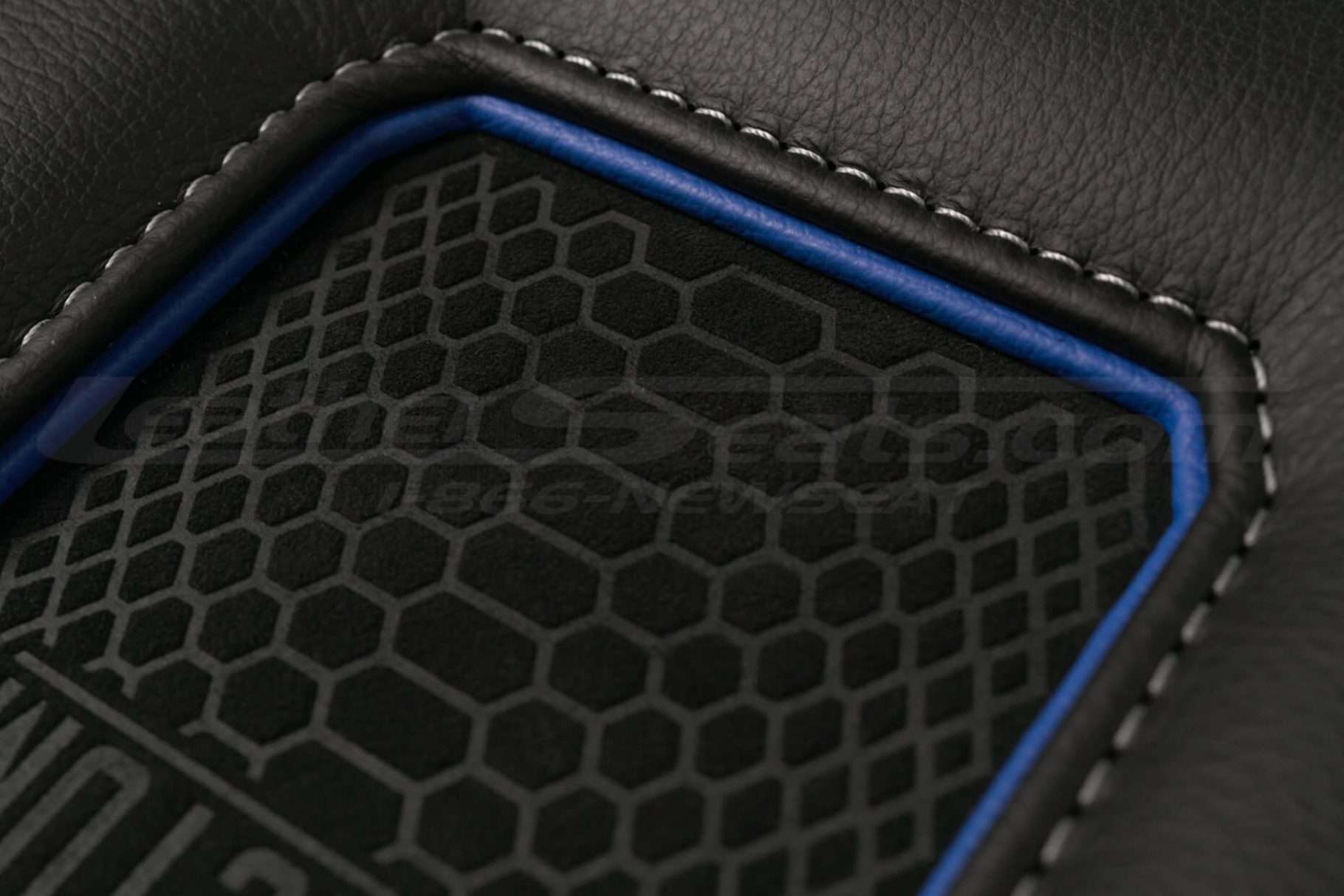 Black leather, matching oem stitching, cobalt trim ring