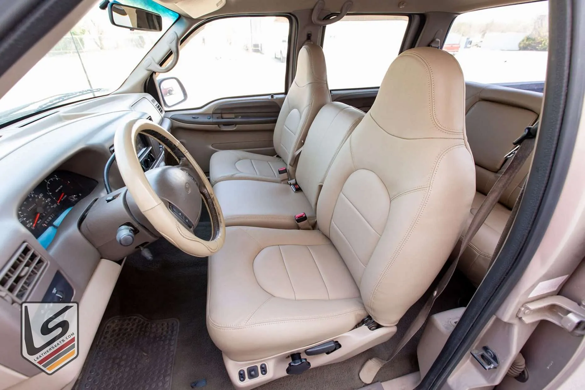 Ford F-250 with Nutmeg leather interior - front jump seat raised position