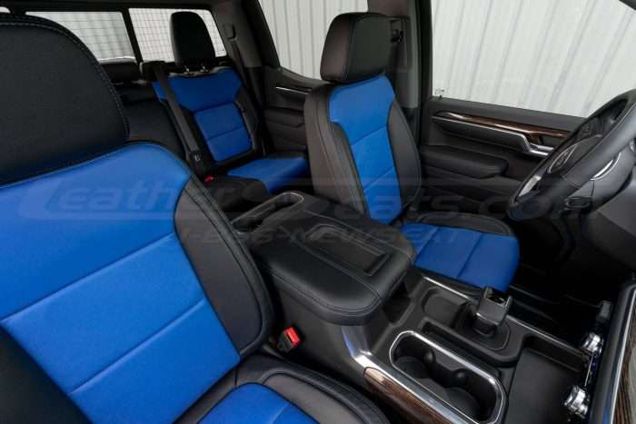 Custom leather console lid cover with installed leather seats in Black & Cobalt
