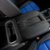 Passenger view of installed leather console lid cover - Black w/ Cobalt stitching