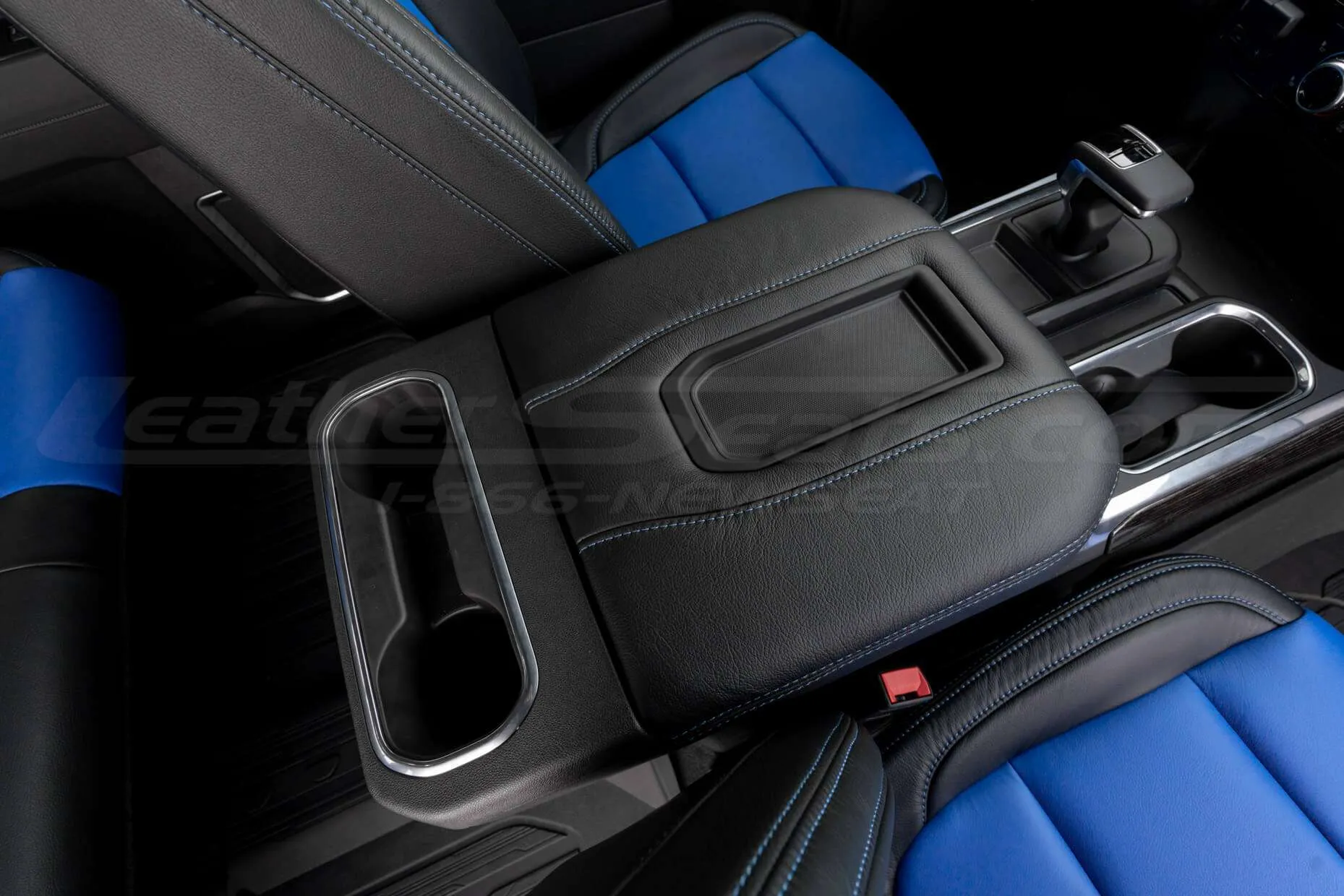 Passenger view of installed leather console lid cover - Black w/ Cobalt stitching