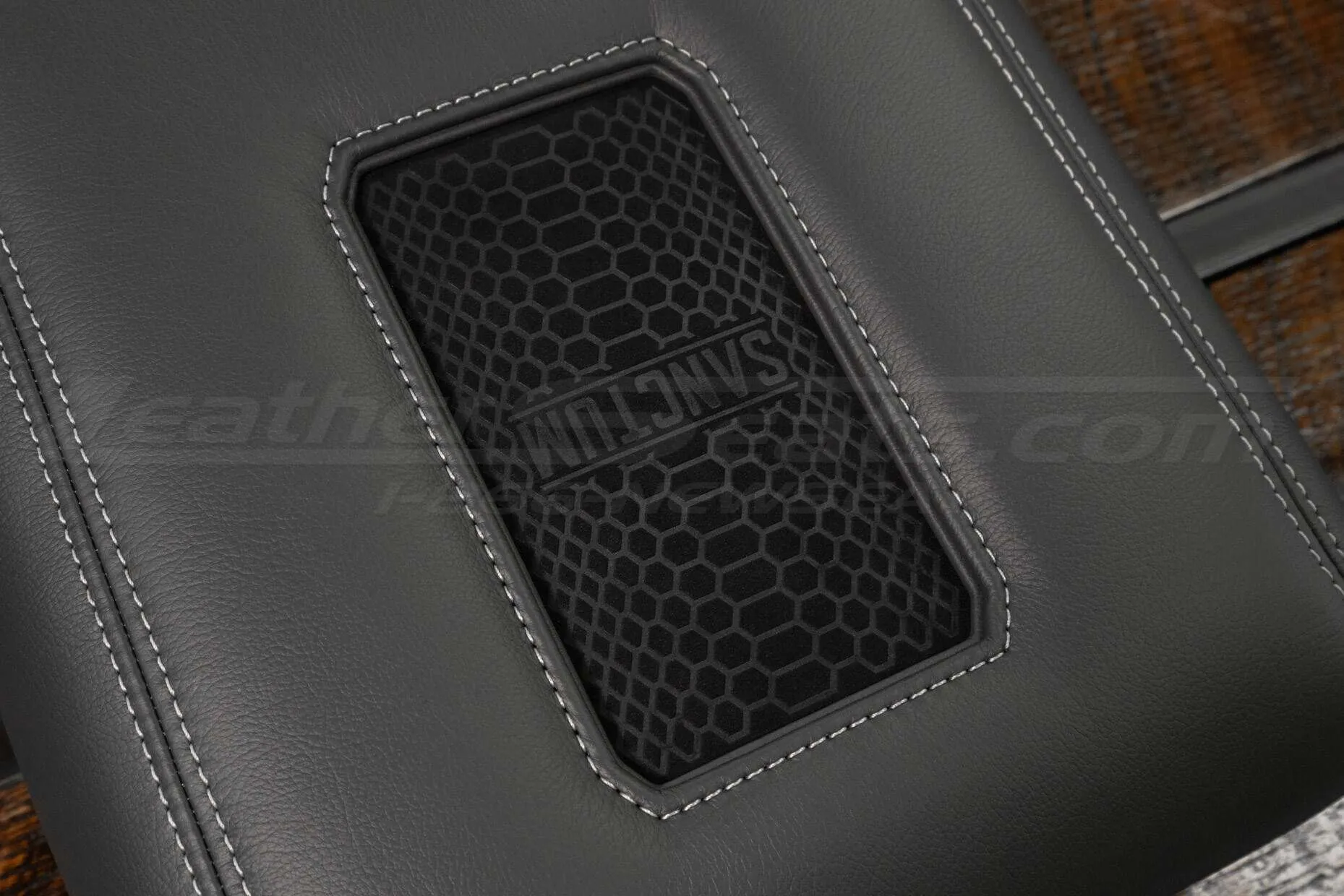 Suede leather charging pad on phone charging console