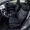 Alternative angle of front driver's seat with custom leather seats