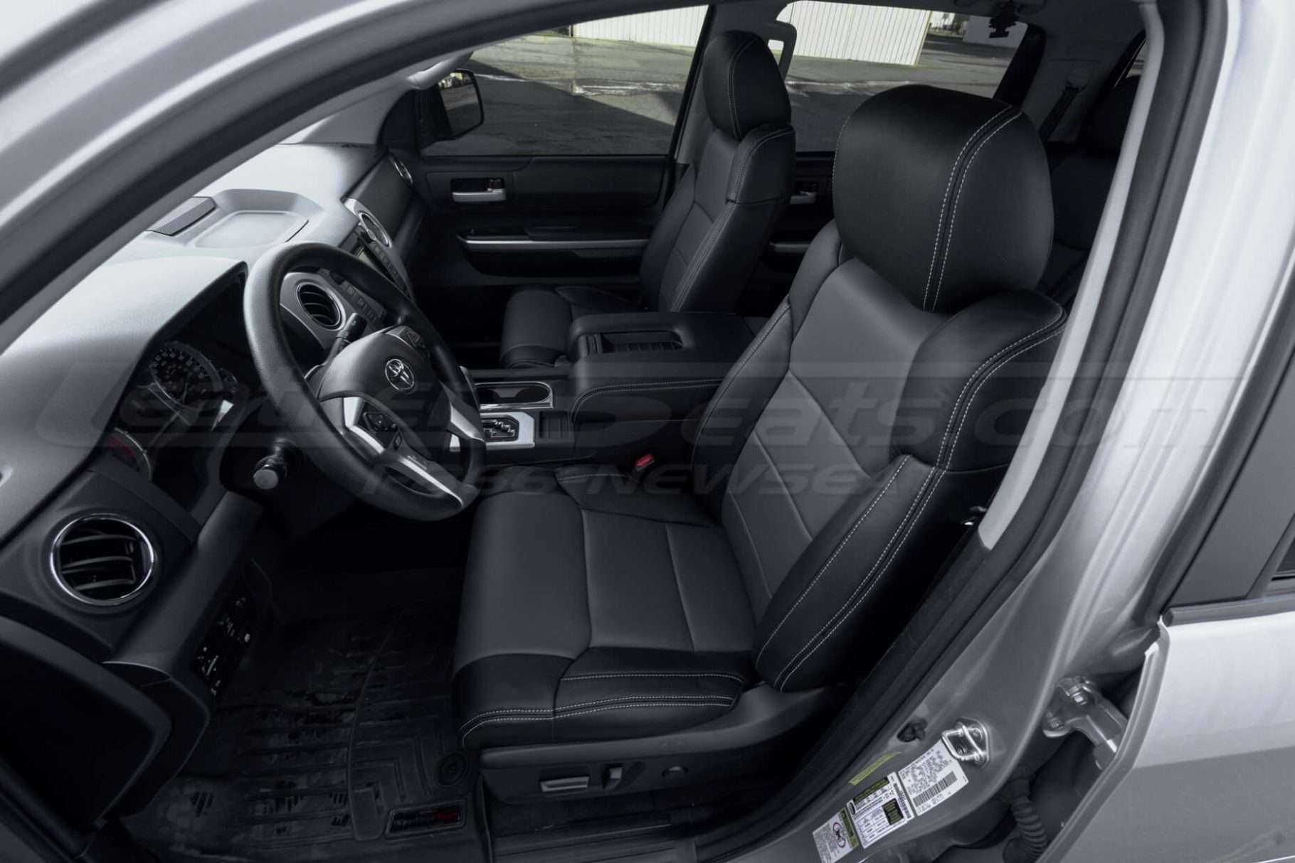 Alternative angle of front driver's seat with custom leather seats