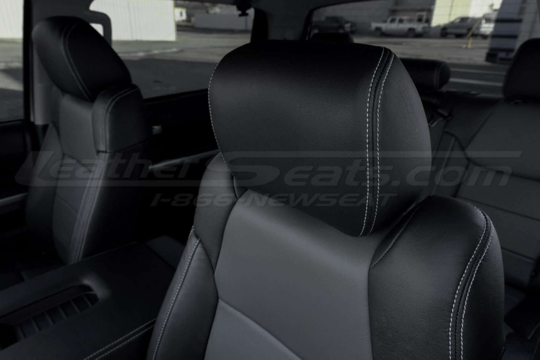 Black leather headrest with contrasting Silver stitching