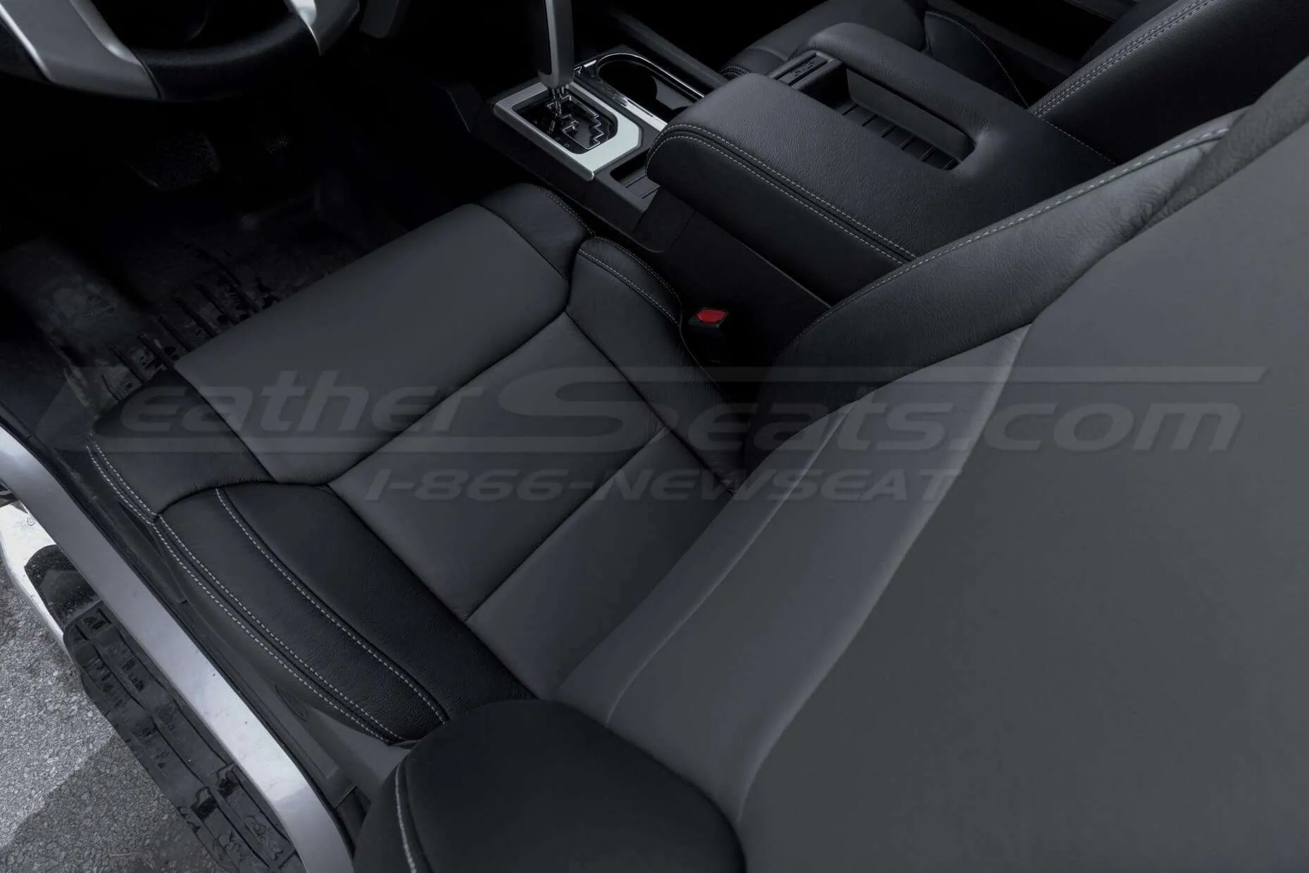 Top down view of two-tone leather seats in black & charcoal