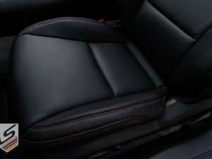 Front seat leather cushion with contrasting double-stitching
