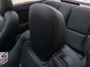 Leather headrest close-up with Cardinal stitching