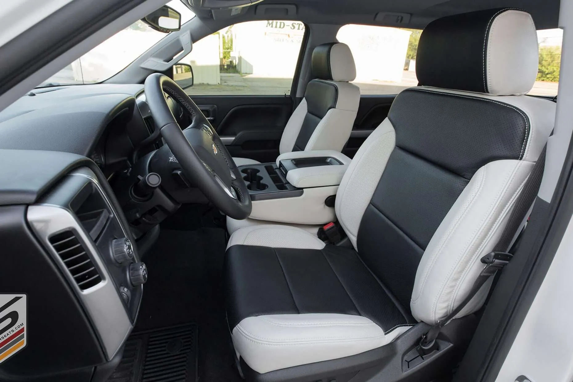 2014-2018 Chevrolet Silverado with custom leatherseats.com upholstery in Alabaster with Black Centers