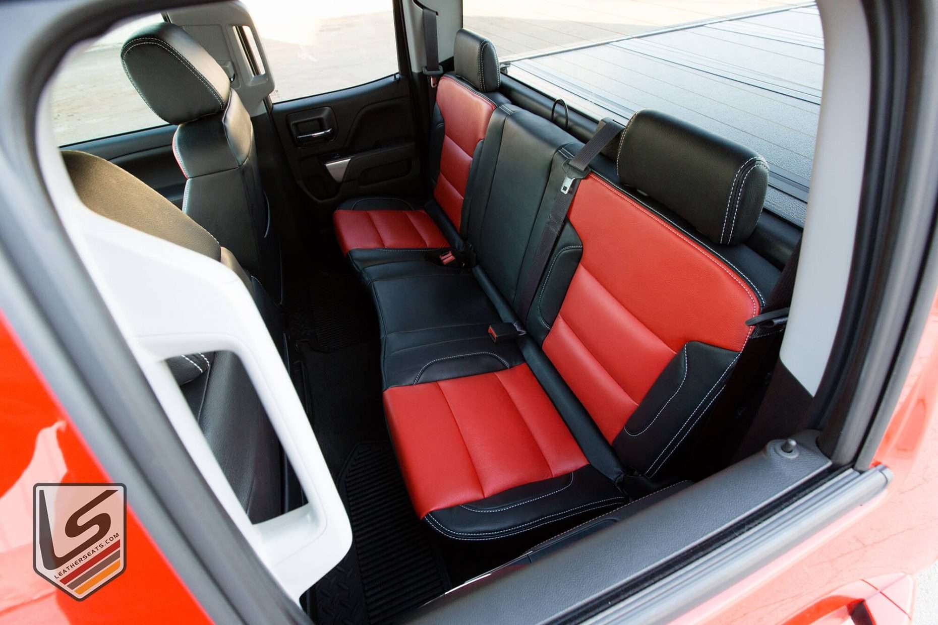 Top-down view of rear leather seats from driver's side