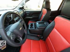 View of front row Silverado interior with custom console lid cover