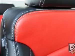 Black and Bright Red leather lose-up with contrasting Silver stitching