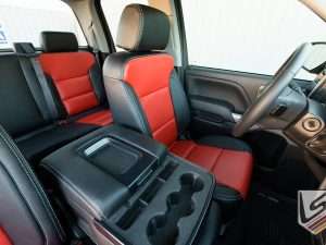 View of leather console lid cover and installed front driver leather seat
