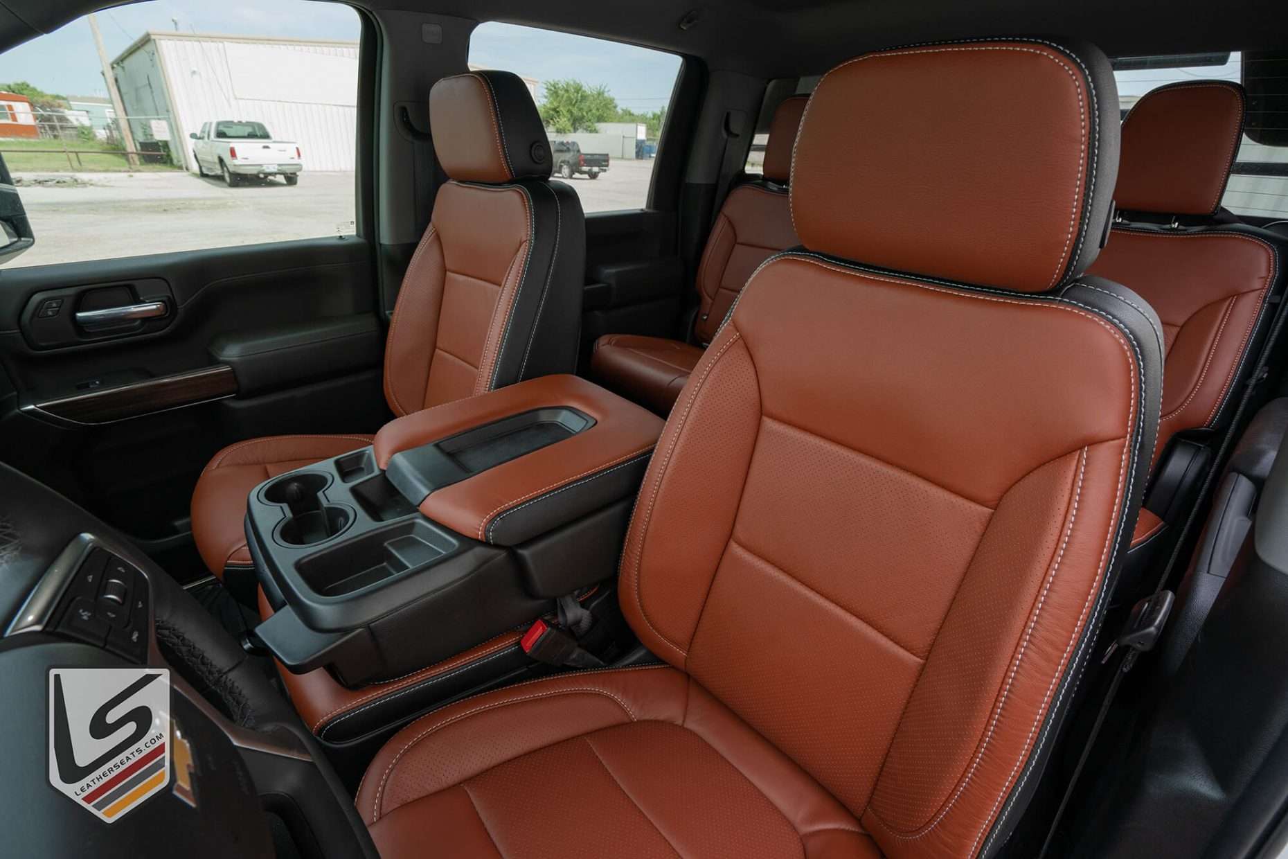 Front driver seat backrest and headrest view with perforated inserts and wings