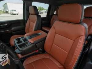 Front driver seat backrest and headrest view with perforated inserts and wings