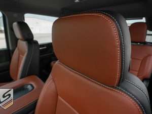 Two-Tone Black and Mitt Brown headrest close-up with contrasting Dove Grey stitching
