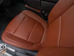 Top-down view looking at font seat cushion with perforation