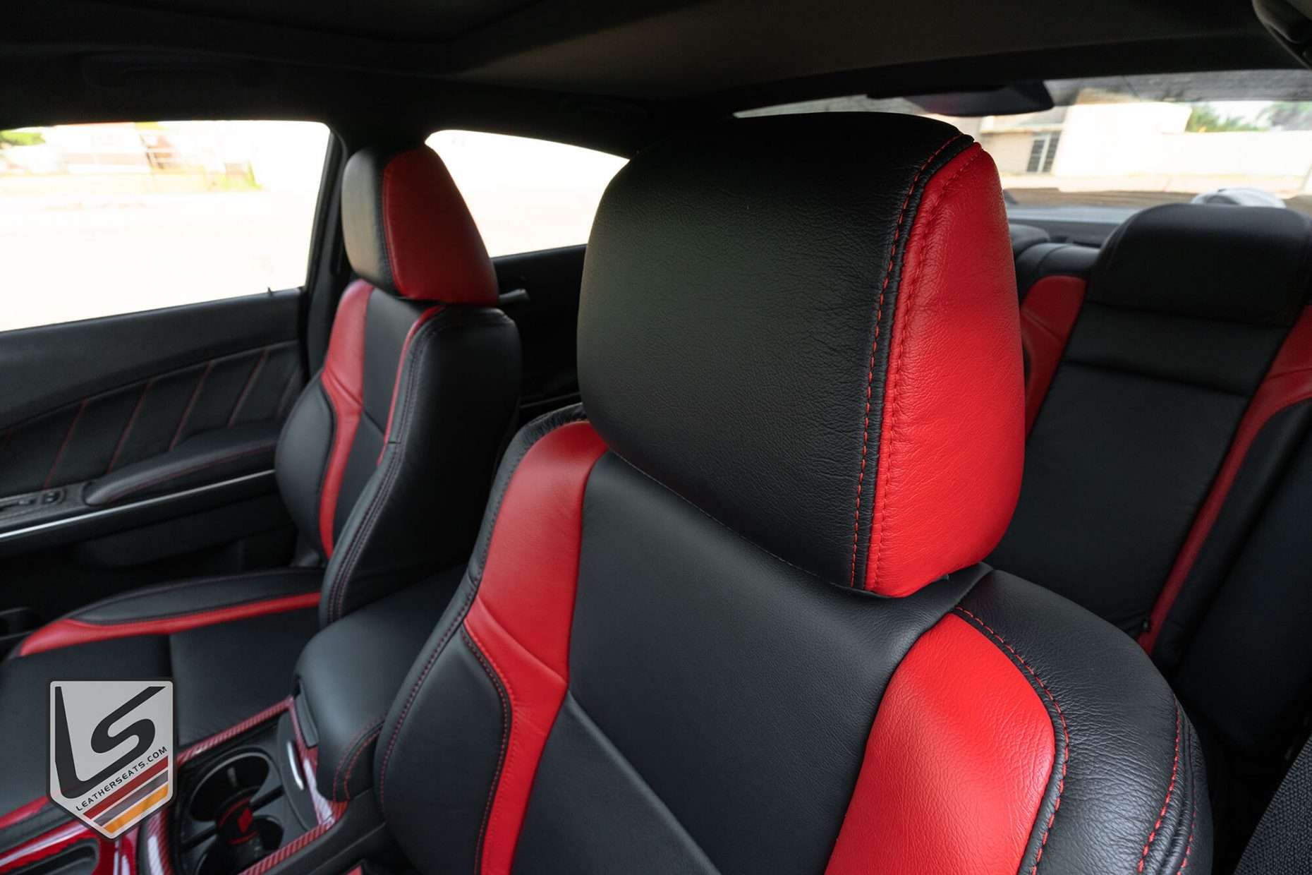 Black and Bright Red headrest close-up with contrasting Bright Red stitching