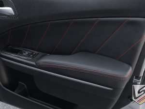 Custom leather door inserts and door armrests in Black with Bright Red stitching