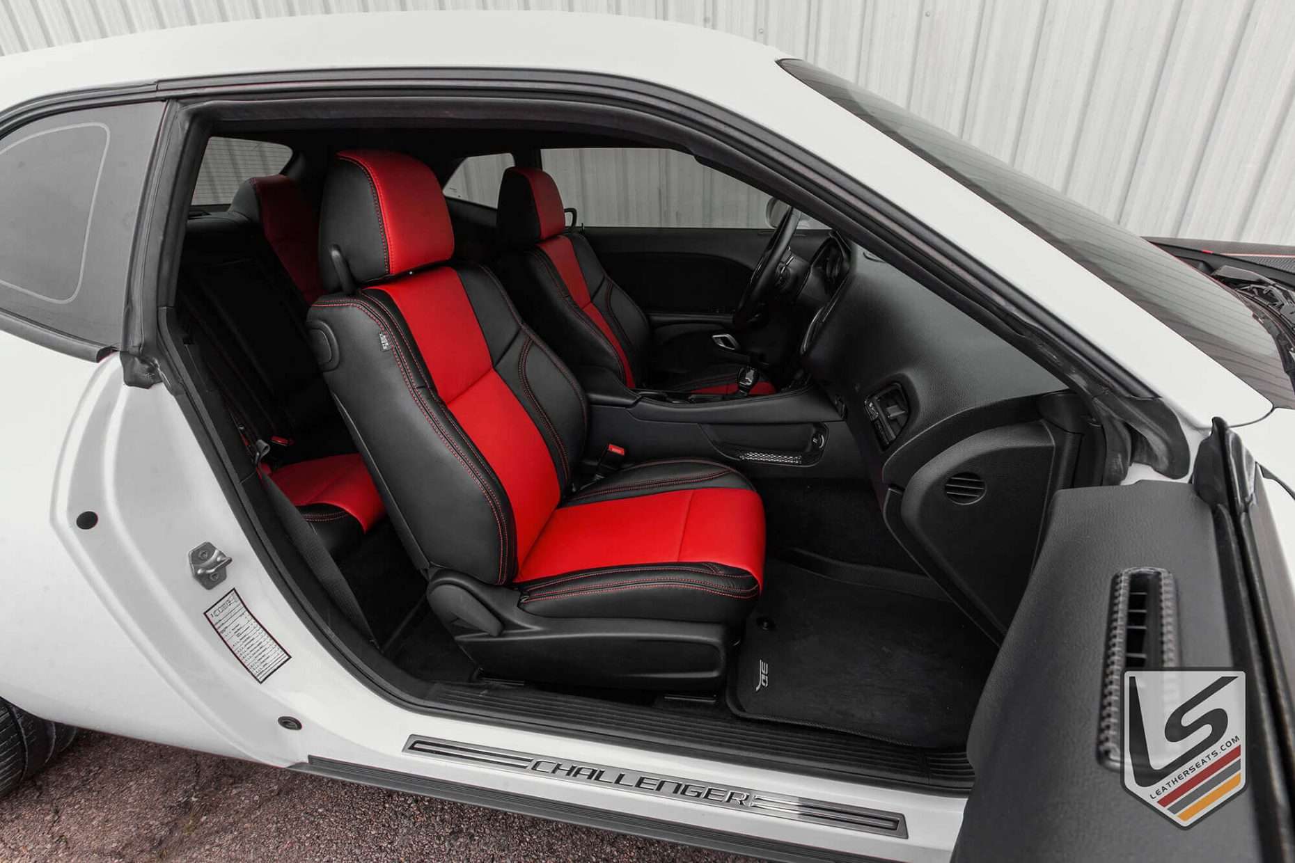 Alternate angle of fron passenger leather seat inn Black & Bright Red