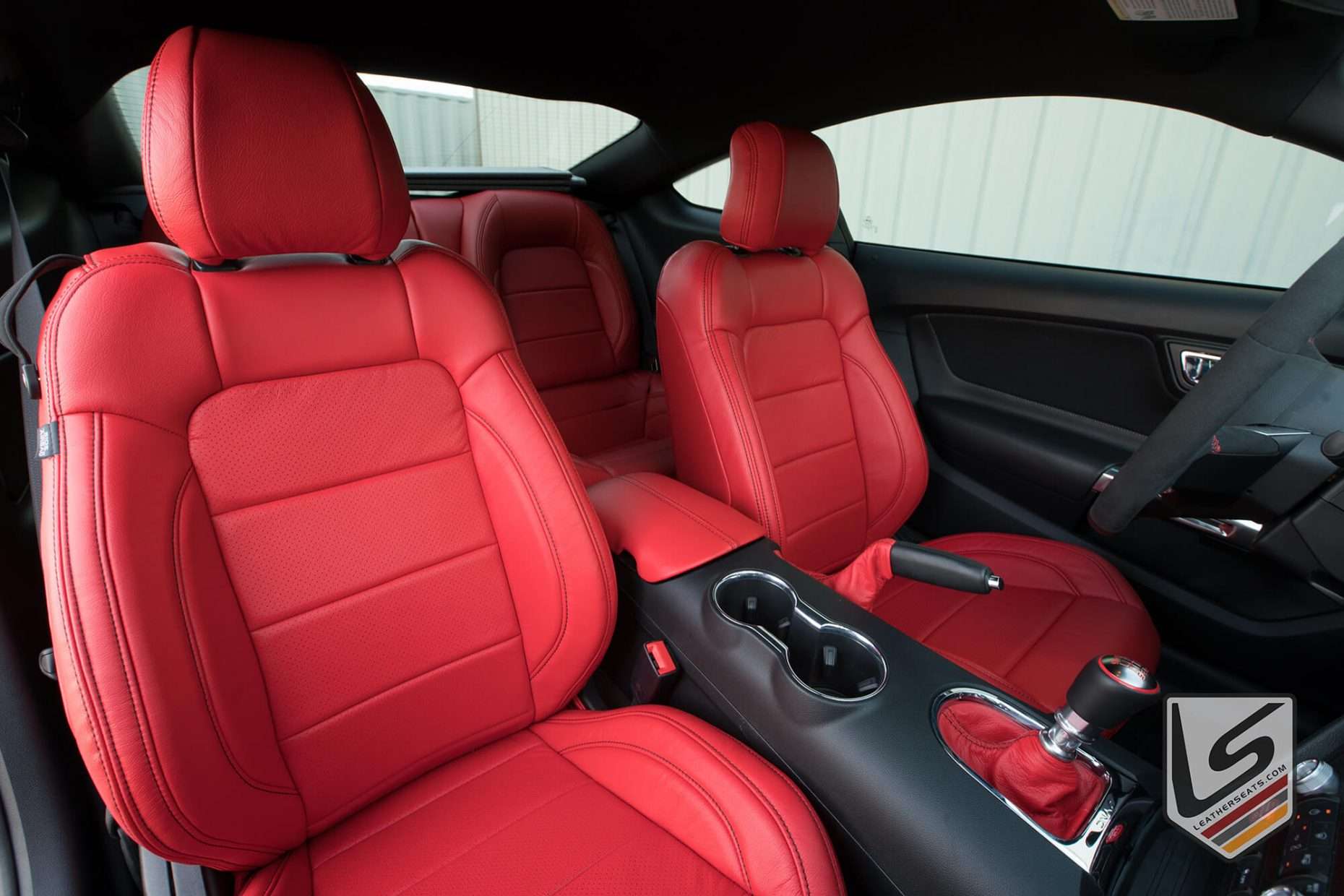 Front backrest and headrest section of Bright Red Ford Mustang seats