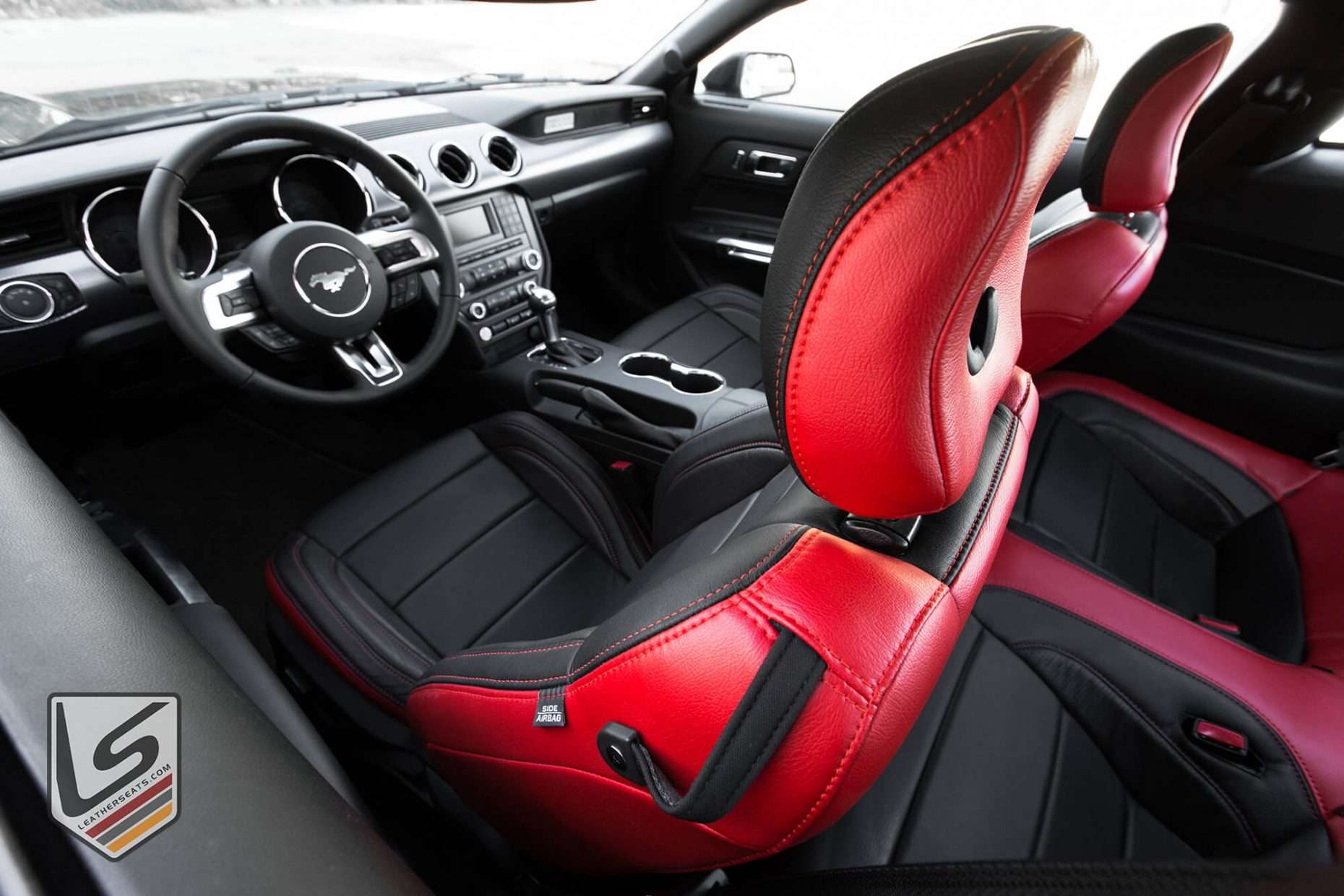 Top-down view of front driver's seat with contrasting Bright Red stitching