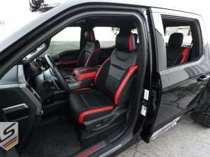 Wide view of Ford Raptor with leatherseats.com custom upholstery - Front driver's side
