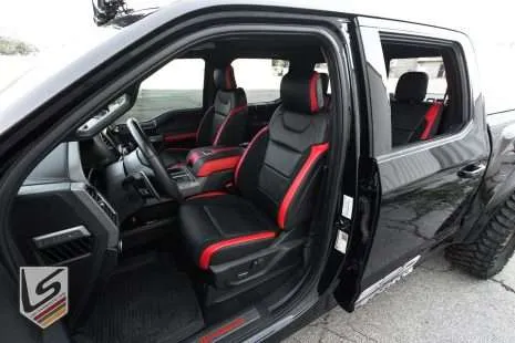 Wide view of Ford Raptor with leatherseats.com custom upholstery - Front driver's side