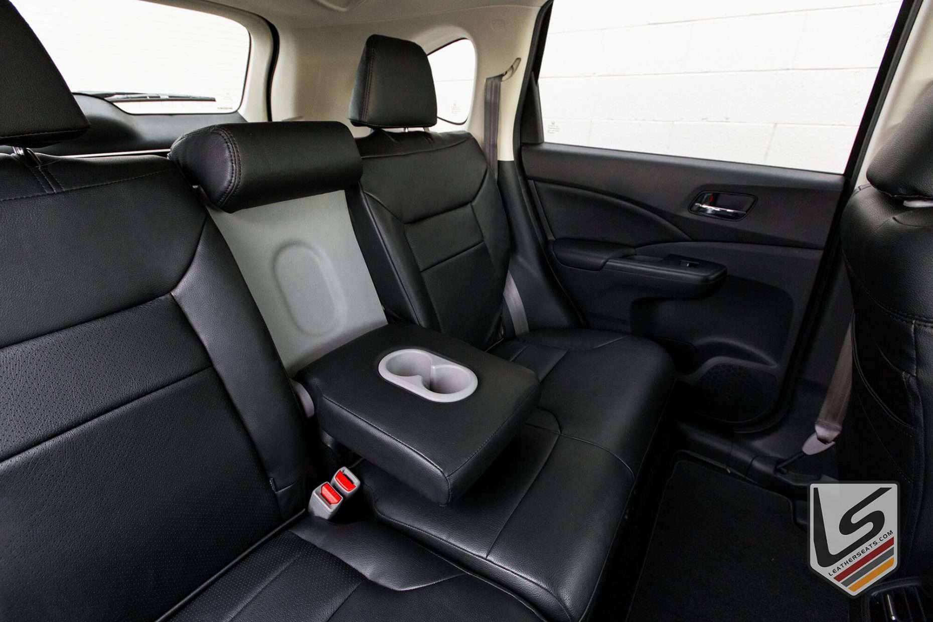 Rear seat leather armrest fold down